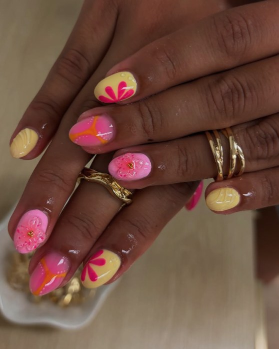 Short pink and yellow nails with hand-painted flowers